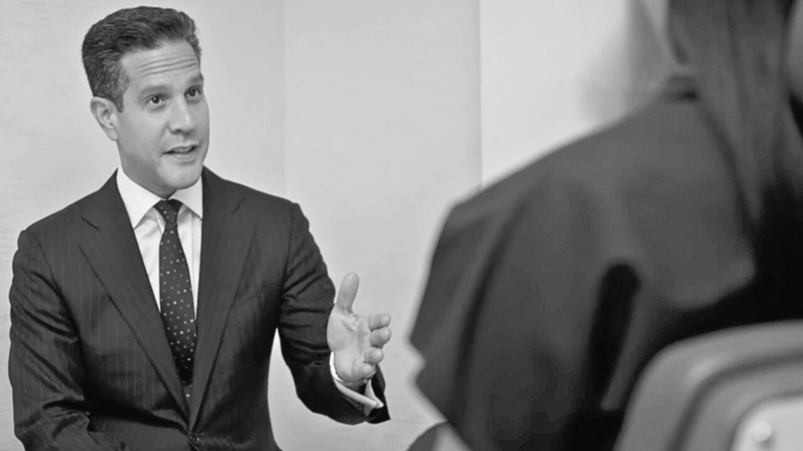Dr. John Diaz During Consultation with a Patient. Photo has a Grayscale filter applied